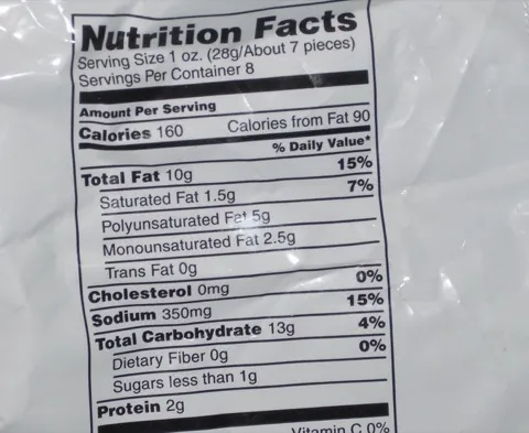 The Nutrition Facts panel on a Cheetos bag: serving size 1 oz, about 7 pieces, 160 calories, 10 g fat, 13 g carbohydrate, 2 g protein.